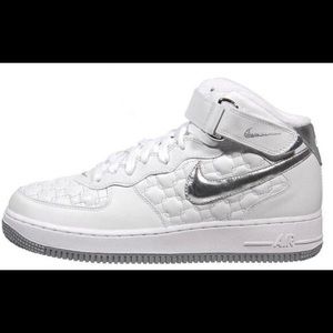 White and silver Nike high tops